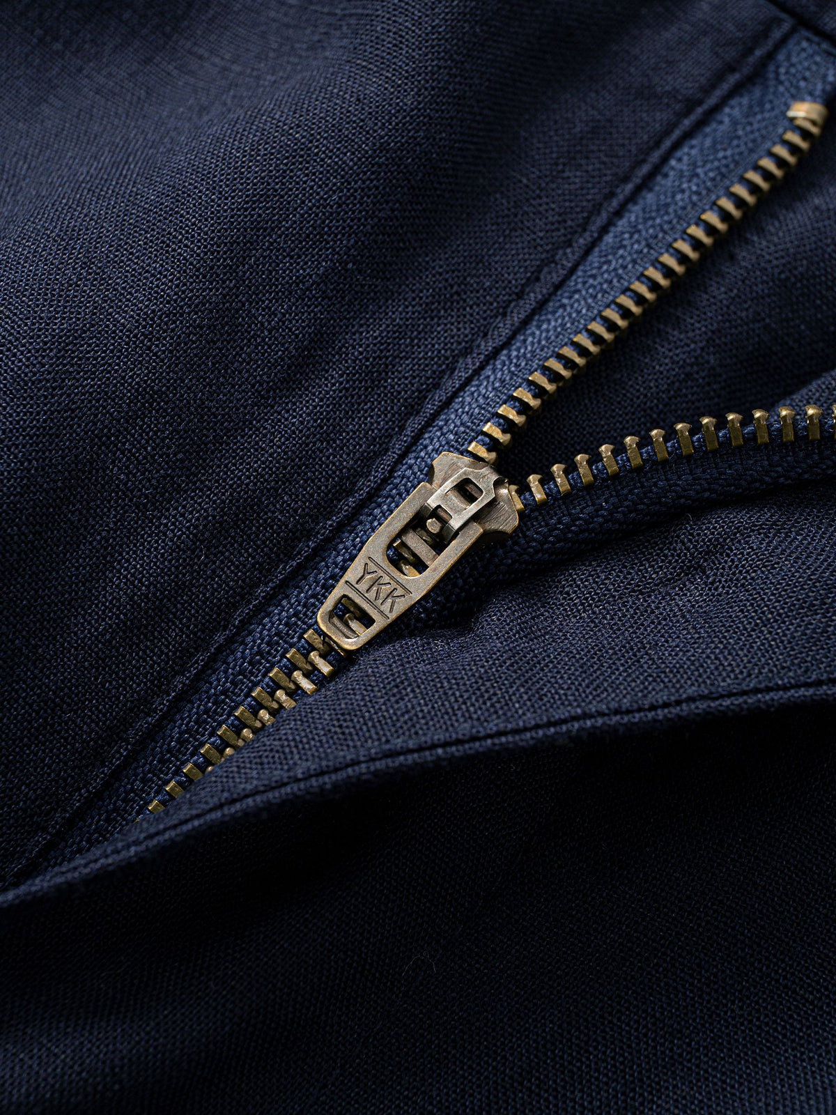 Zipper fly and front button closure detail on OROMEN Navy Linen Trousers