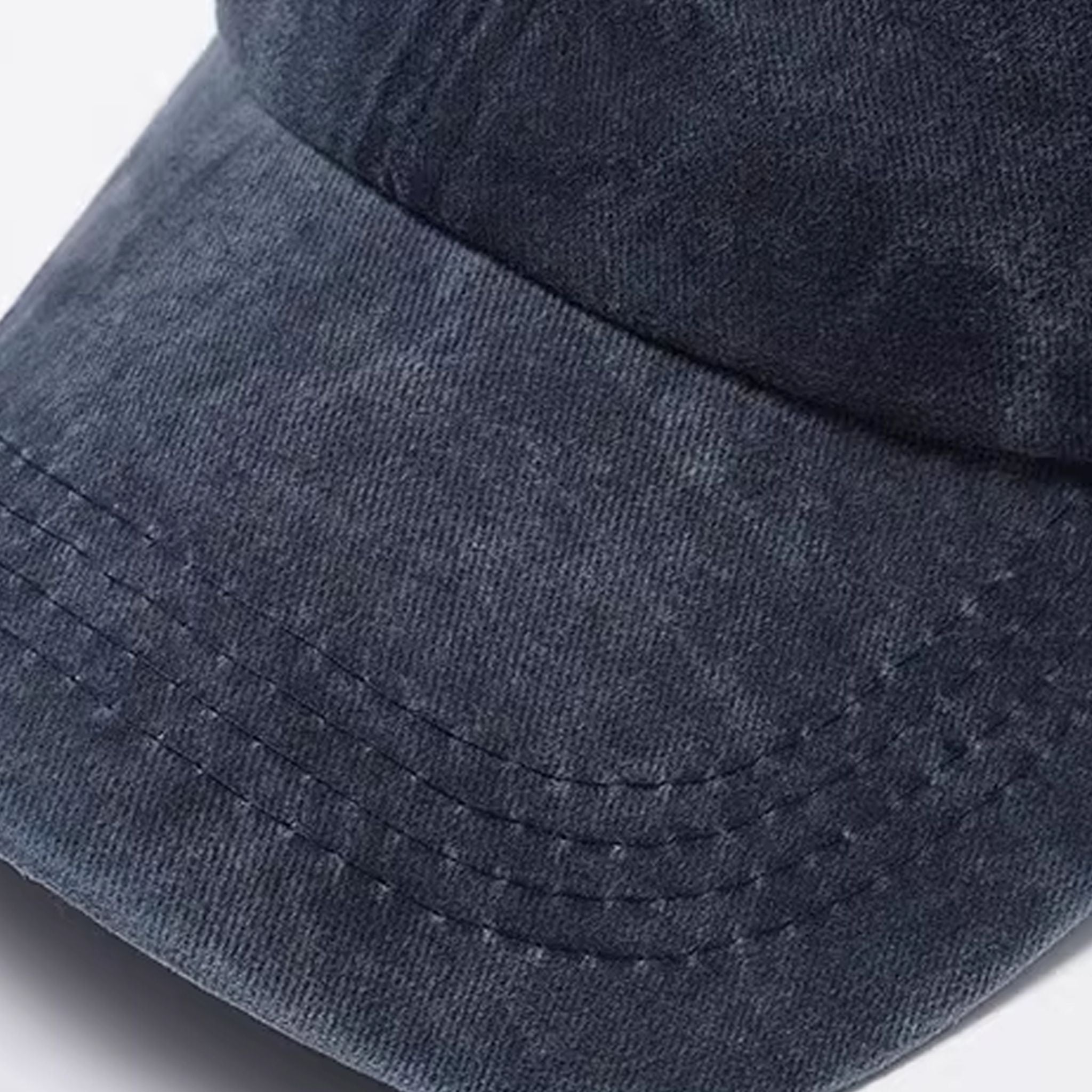 Back view of adjustable cotton denim baseball cap with metal buckle closure