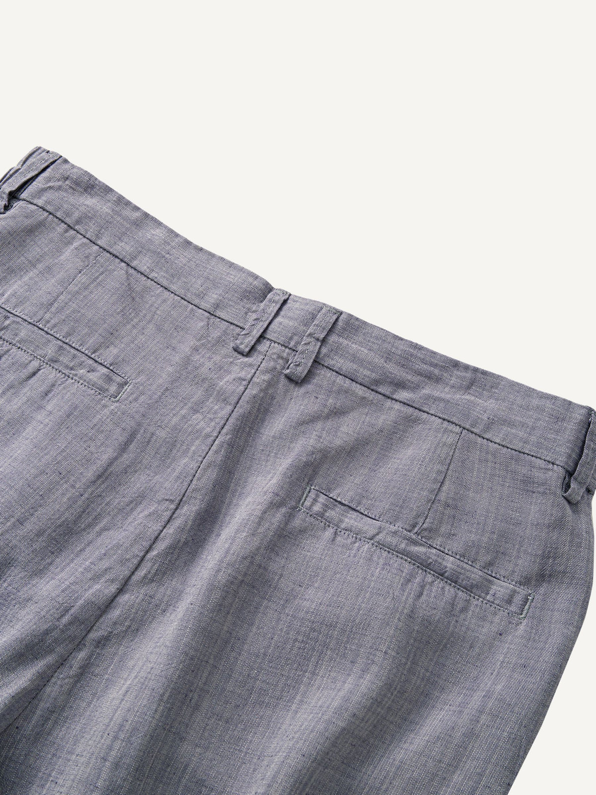 Back waistband detail of OROMEN Pleated Relaxed Fit Linen Trousers with elastic waist