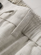 Belt loop detail on OROMEN Crosshatch Weave Relaxed Trousers