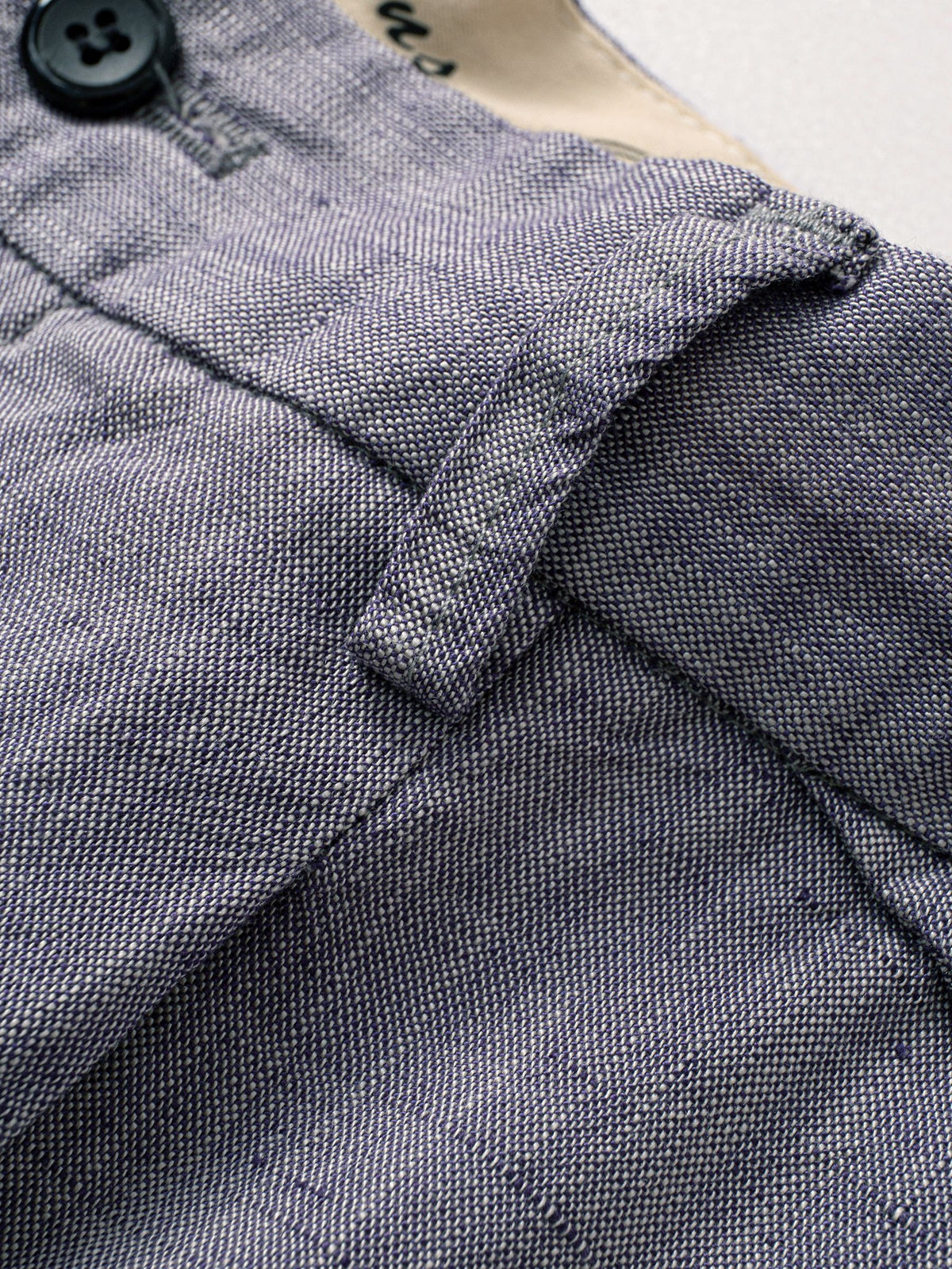 Belt loop detail on OROMEN Pleated Relaxed Fit Linen Trousers
