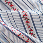 Blue embroidered floral striped button-down shirt with Japanese-inspired design