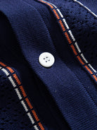 Button closure and placket detail of OROMEN Tally Stripe Open-Knit Shirt