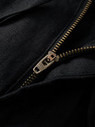 Button fly and zipper closure detail of OROMEN Crosshatch Weave Drawstring Trousers