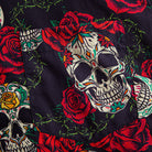 Chest pocket detail of OROMEN Bloom And Death Hawaiian shirt – sugar skull and red rose print on black