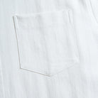 Chest pocket detail of OROMEN Embossed Striped Shirt – white Tencel™ linen with tonal embossed stripe texture