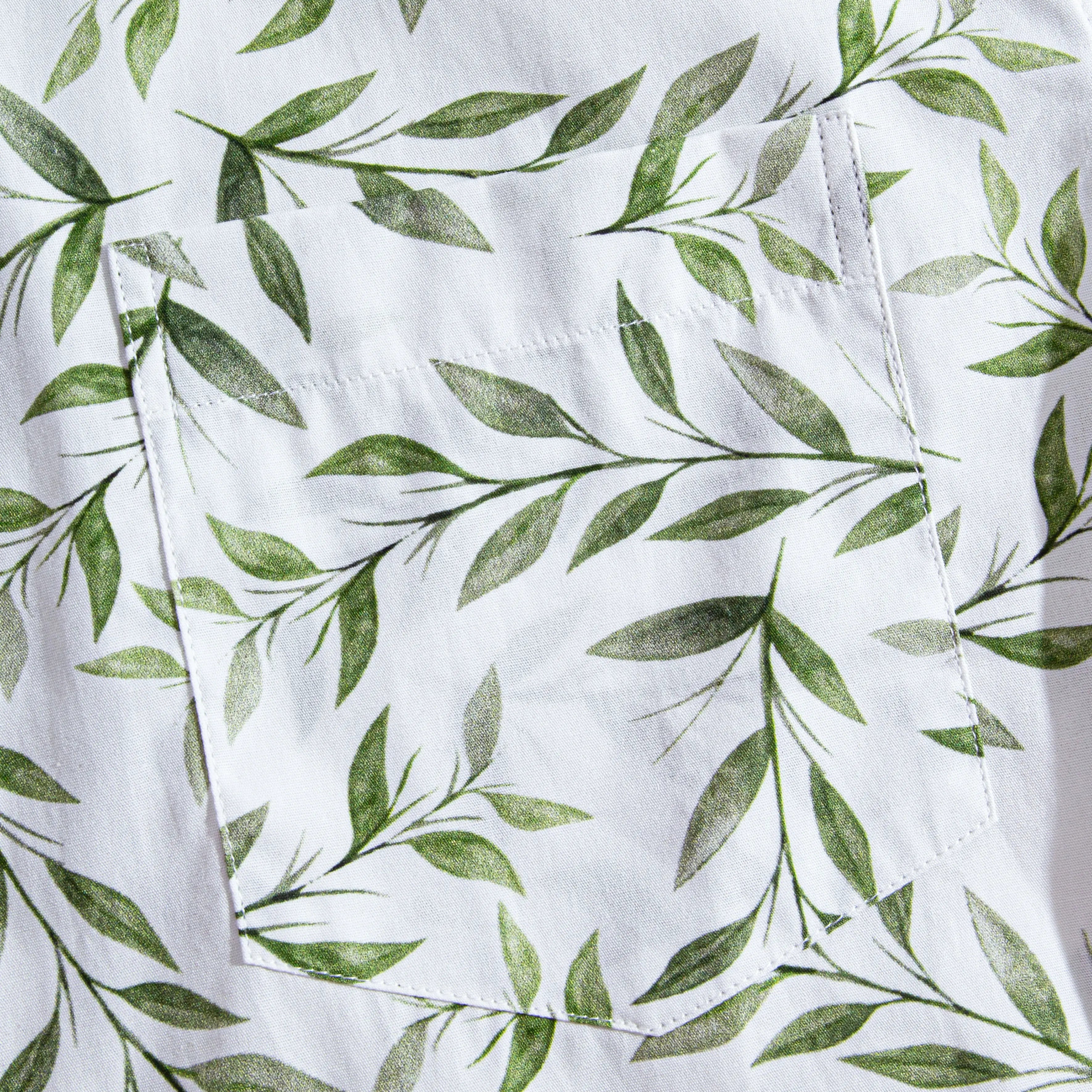 Chest pocket detail of OROMEN Willow Bough Hawaiian shirt – green willow branch print on white