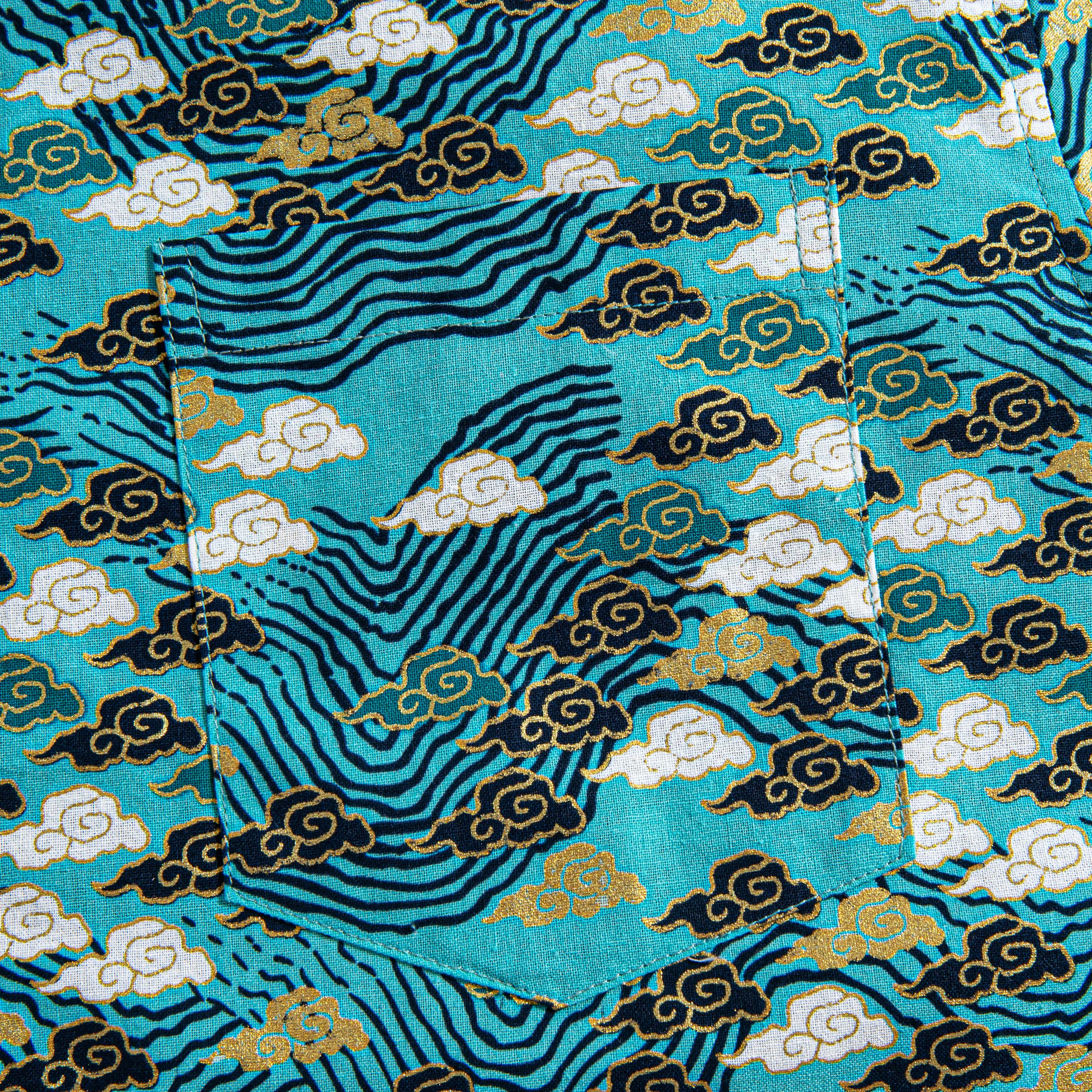 Chest pocket detail with Auspicious Clouds pattern on OROMEN shirt