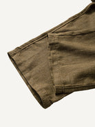 Clean hem and relaxed straight leg cuff detail of OROMEN Herringbone Weave Linen Trousers