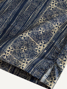 Clean hemline and side vent detail of OROMEN Indigo Batik Shirt