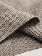 Clean ribbed bottom hemline detail of OROMEN Contrast Collar Knitted Sweater