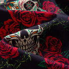 Close-up of OROMEN Bloom And Death shirt fabric – black sugar skull and red rose print with silky drape