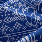 Close-up of OROMEN Plant Totem shirt fabric – navy blue hand-painted retro totem geometric print with silky drape