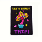 Close-up of "Let's Take A Trip" Pixel Mushroom Embroidery Pattern Detail on OROMEN T-Shirt