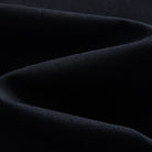 Close-up of black linen-cotton woven fabric texture, OROMEN long-sleeve shirt
