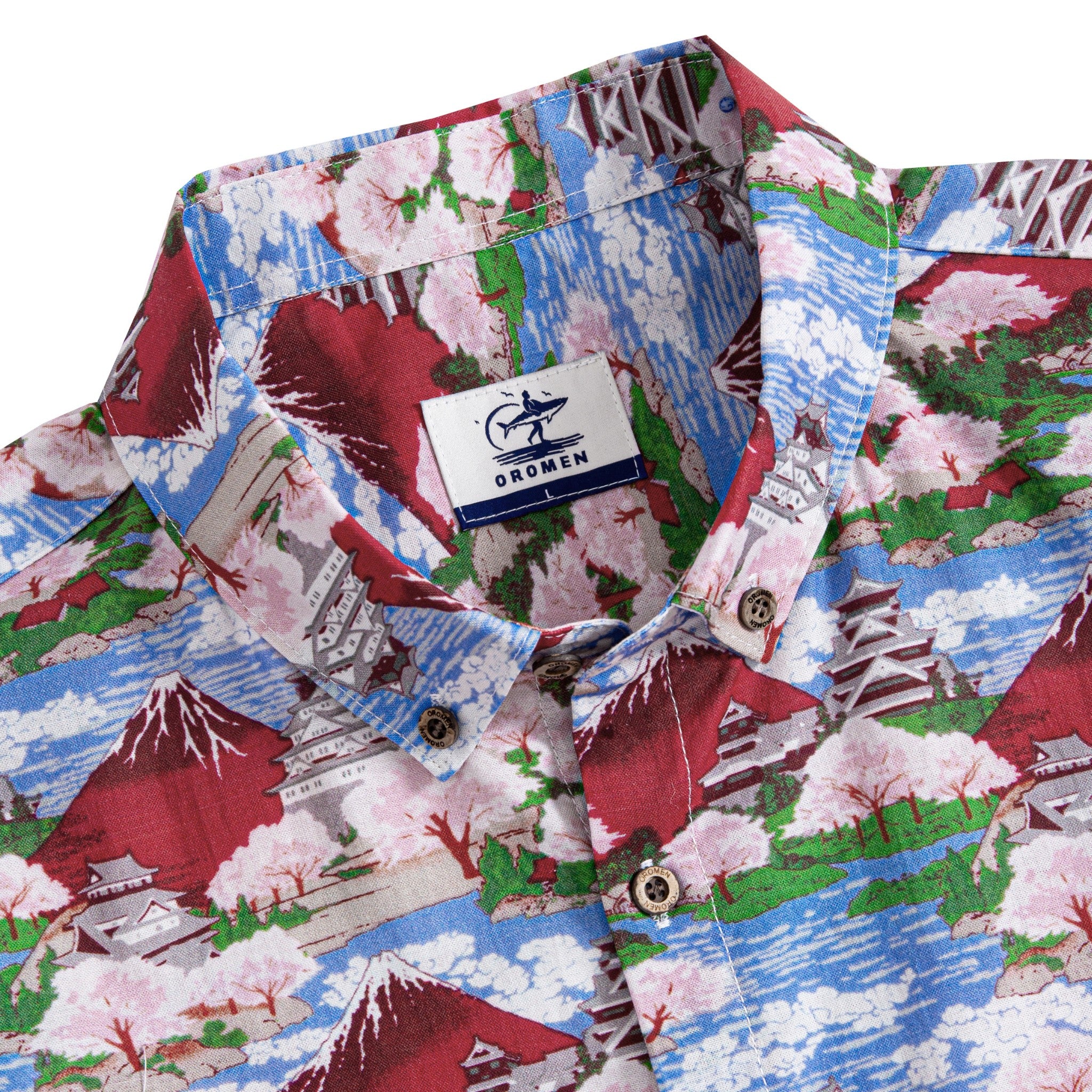 Close-up of hand-painted Ukiyo-e print with Mount Fuji and cherry blossom details on cotton shirt
