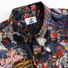 Close-up of hand-painted warrior elements on cotton Hawaiian shirt