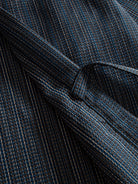 Close-up of the adjustable front-tie detail