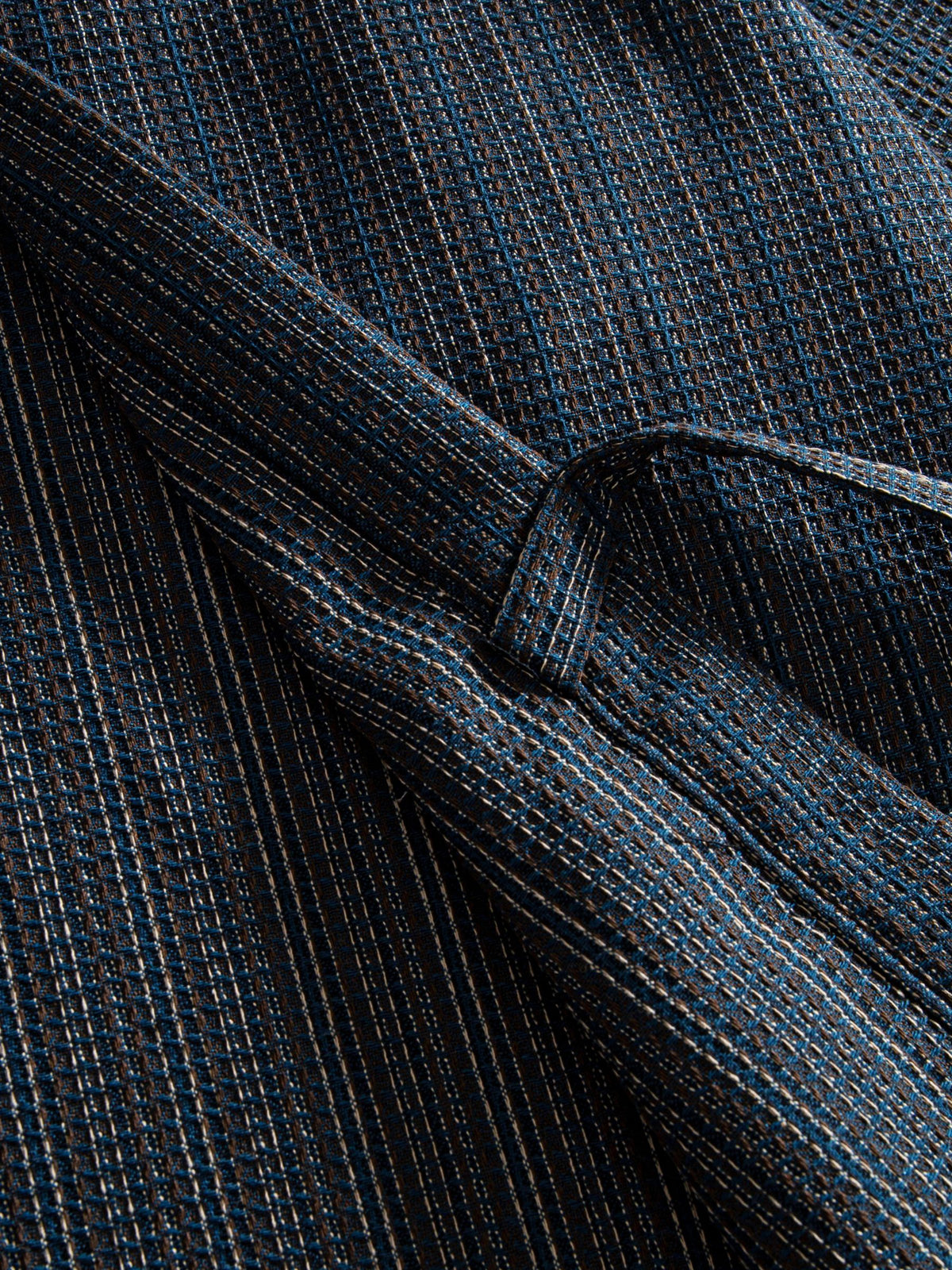 Close-up of the adjustable front-tie detail