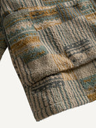 Close-up of the front patch pocket and geometric pattern