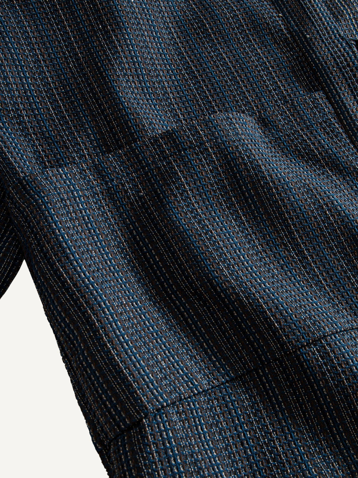 Close-up of the front patch pocket and woven texture