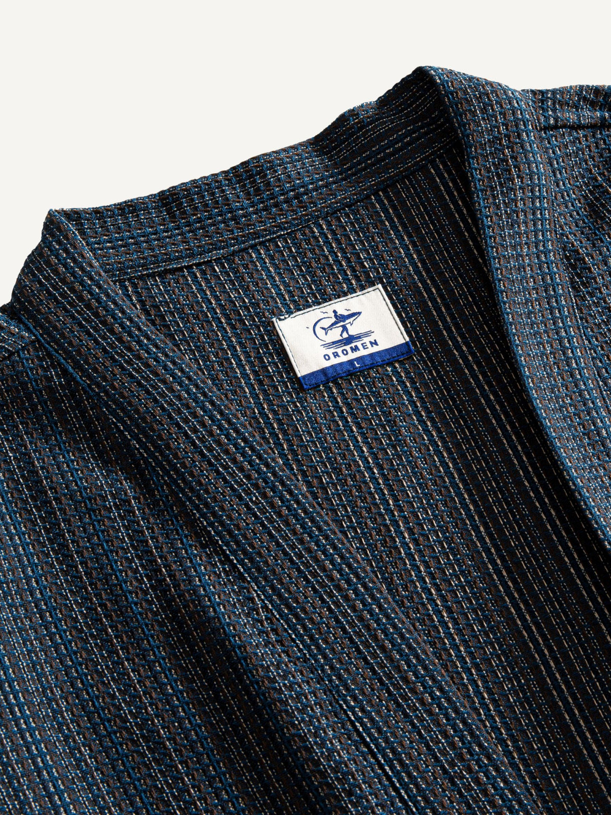 Close-up of the structured neckline and textured cotton-linen weave