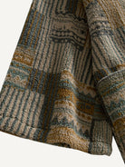 Close-up of the wide sleeve cuff and textured finish