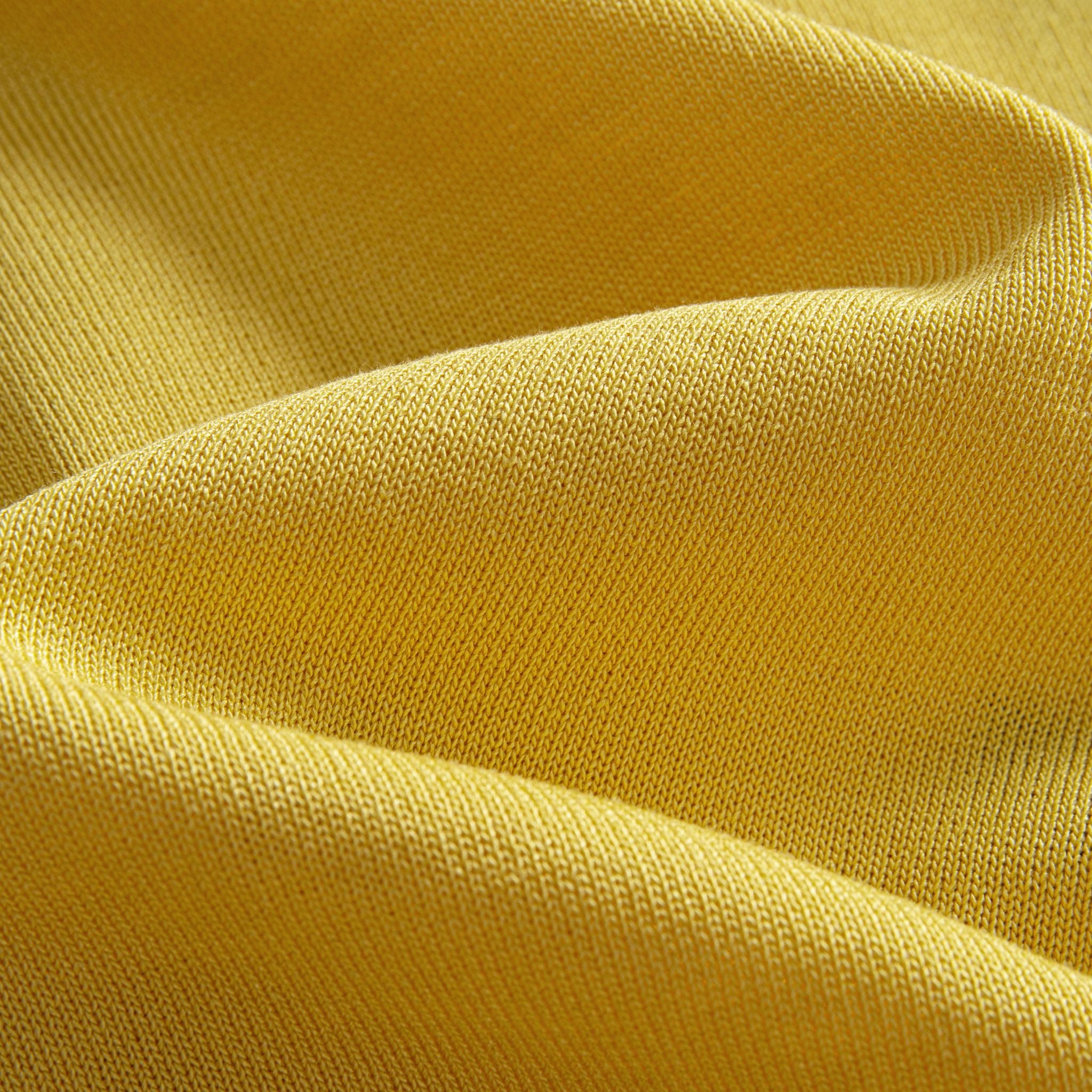 Close-up of yellow viscose ice silk knit fabric with diamond jacquard stripe pattern – OROMEN