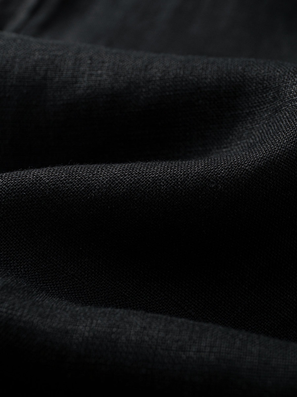 Close-up texture of 100% slub linen crosshatch weave on OROMEN Crosshatch Weave Drawstring Trousers