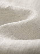 Close-up texture of 100% slub linen crosshatch weave on OROMEN Crosshatch Weave Relaxed Trousers