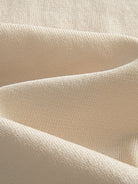 Close-up texture of ice silk viscose knit fabric on OROMEN Toasted Trim Knit Polo