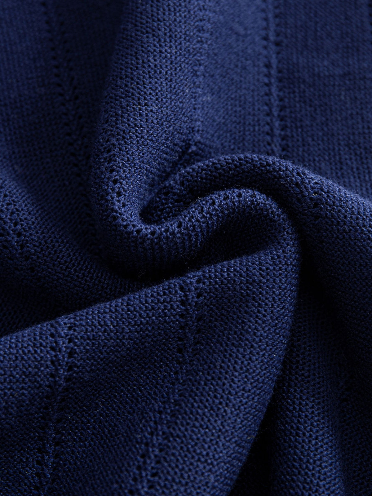 Close-up texture of openwork pointelle stripe knit fabric on OROMEN Contrast Tipped Knitted Sweater