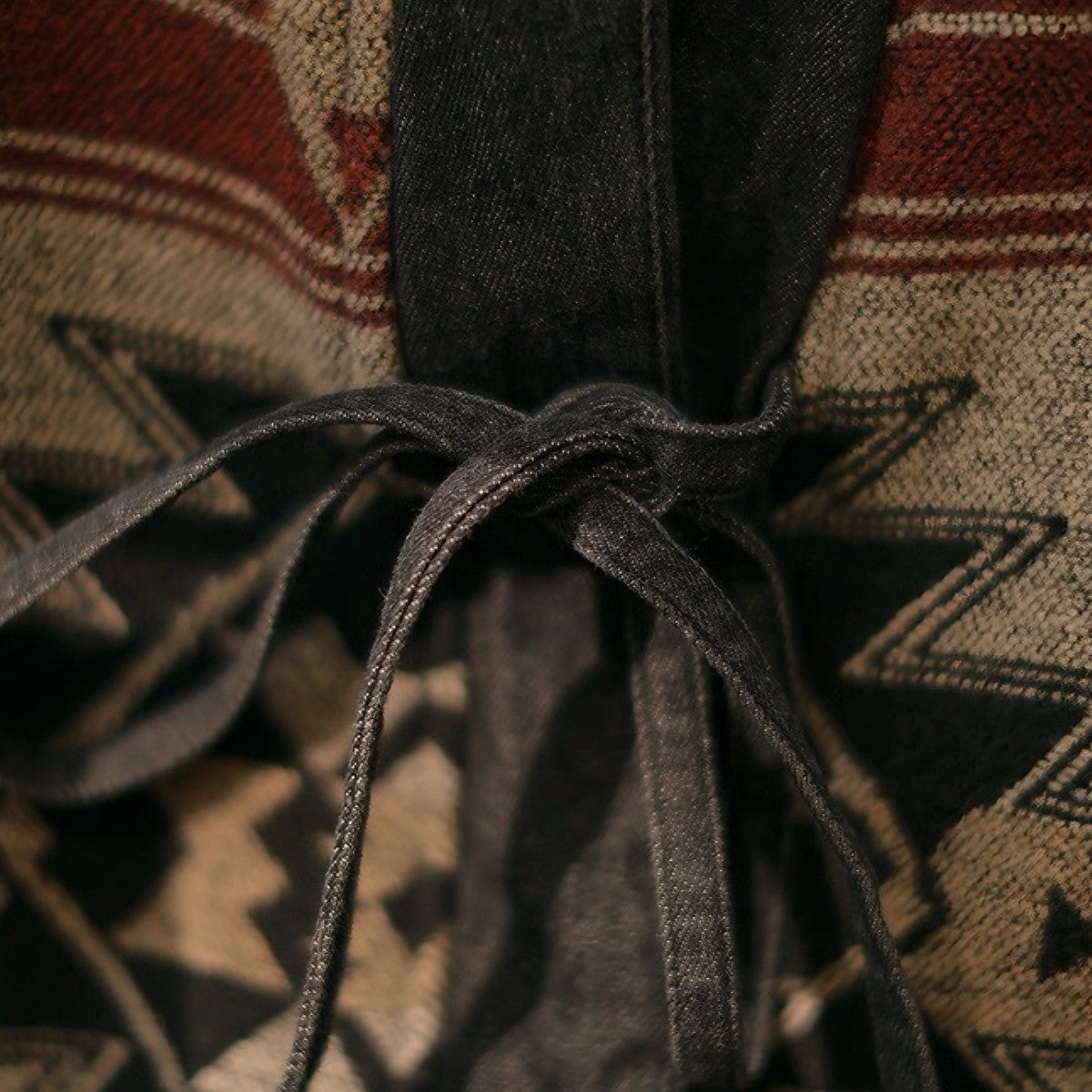 Close-up fabric texture of OROMEN KIMONO017, 100% cotton flannel brushed surface, Navajo tribal woven pattern detail