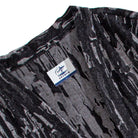 Close-up of OROMEN KIMONO015 collarless neckline, jacquard crackle weave at collar edge