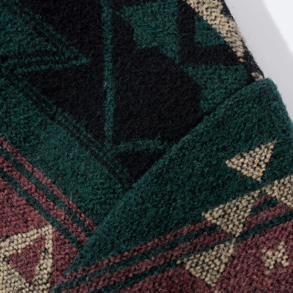 Close-up of OROMEN KIMONO018 jacquard pattern detail, intricate woven motif, navy and contrast thread interplay, artisan textile