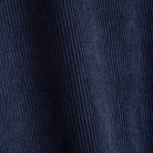 Close-up of navy blue 100% polyester corduroy ribbed texture on OROMEN colorblock hooded shirt