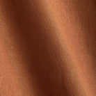 Close-up of rust brown 100% polyester fabric texture on OROMEN hooded short-sleeve shirt
