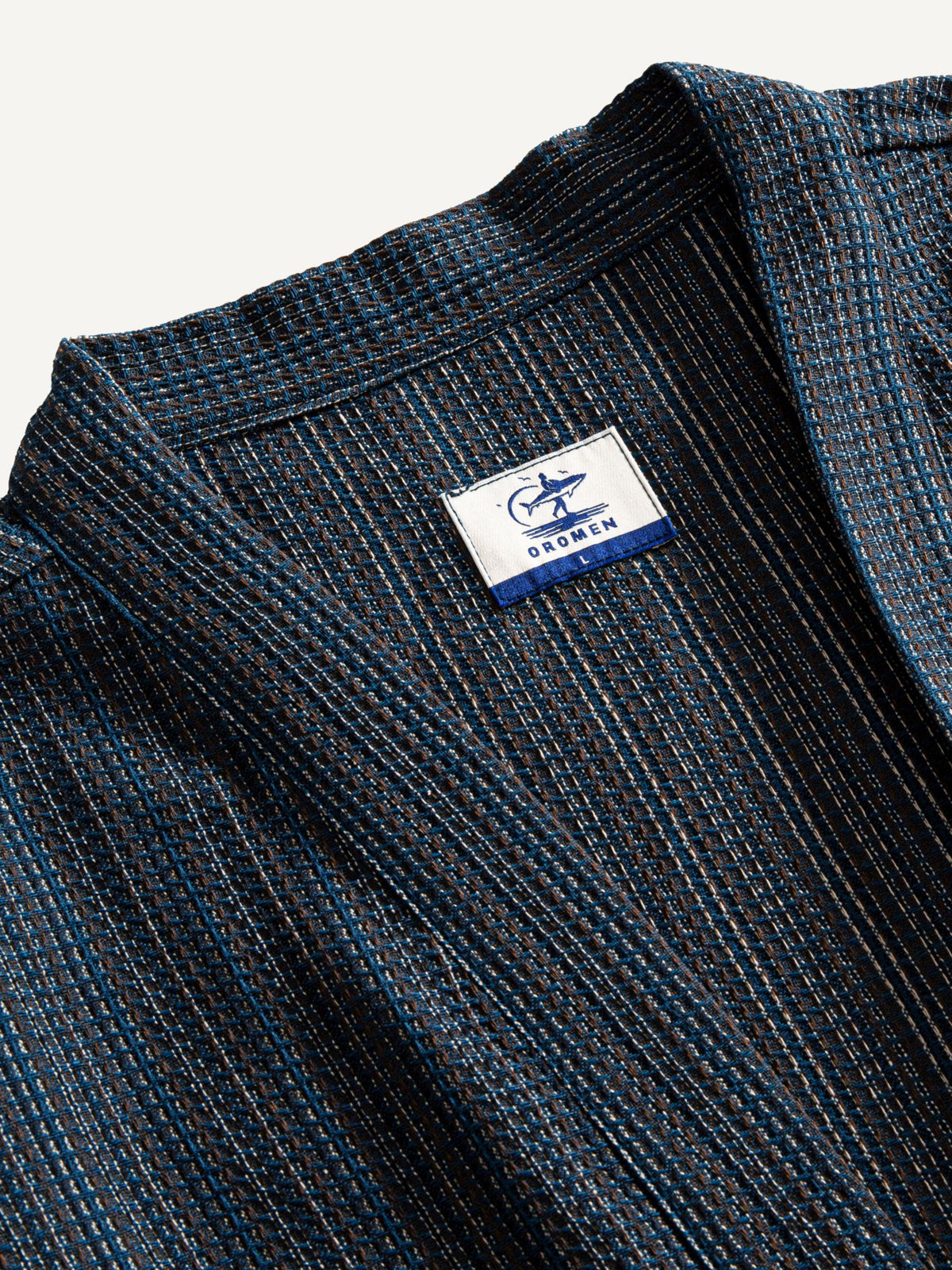 Collar detail of OROMEN textured tie-front kimono cardigan