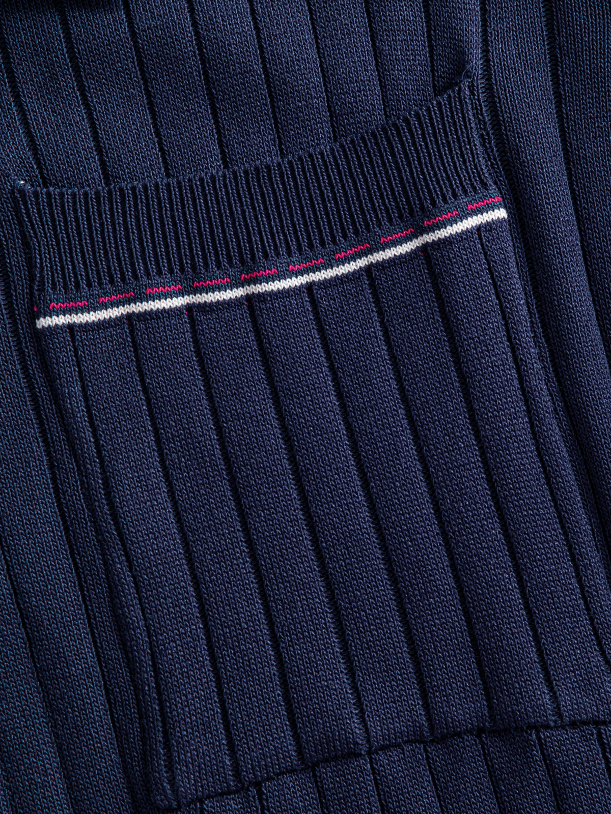 Contrast-tipped chest pocket detail on OROMEN Contrast-Tipped Ribbed Knit Polo