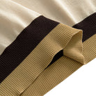 Contrast ribbed hem detail in dark brown and khaki stripe on men's cream knit polo shirt – OROMEN