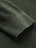 Detailed view of long sleeve ribbed cuffs on heathered olive knit cardigan