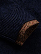 Detailed view of ribbed long sleeve cuffs with subtle contrast tipping