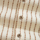 Embroidered stripe shirt back view with box pleat detail