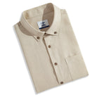 Folded OROMEN Versatile Shirt – beige Tencel™ linen button-down with coconut buttons and brand label, ready to gift