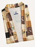 Folded flat lay of OROMEN beige patchwork floral kimono jacket