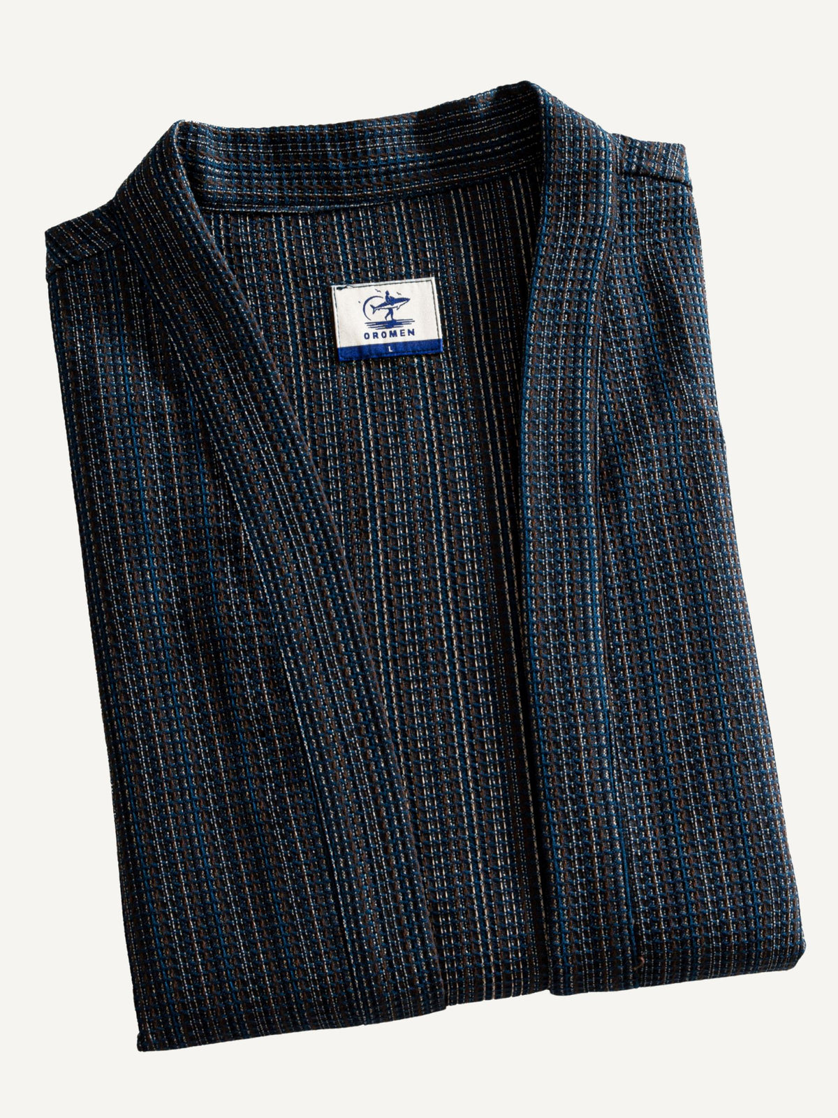Folded flat lay of OROMEN textured tie-front kimono cardigan