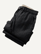 Folded view of OROMEN Crosshatch Weave Drawstring Trousers