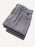 Folded view of OROMEN Pleated Relaxed Fit Linen Trousers