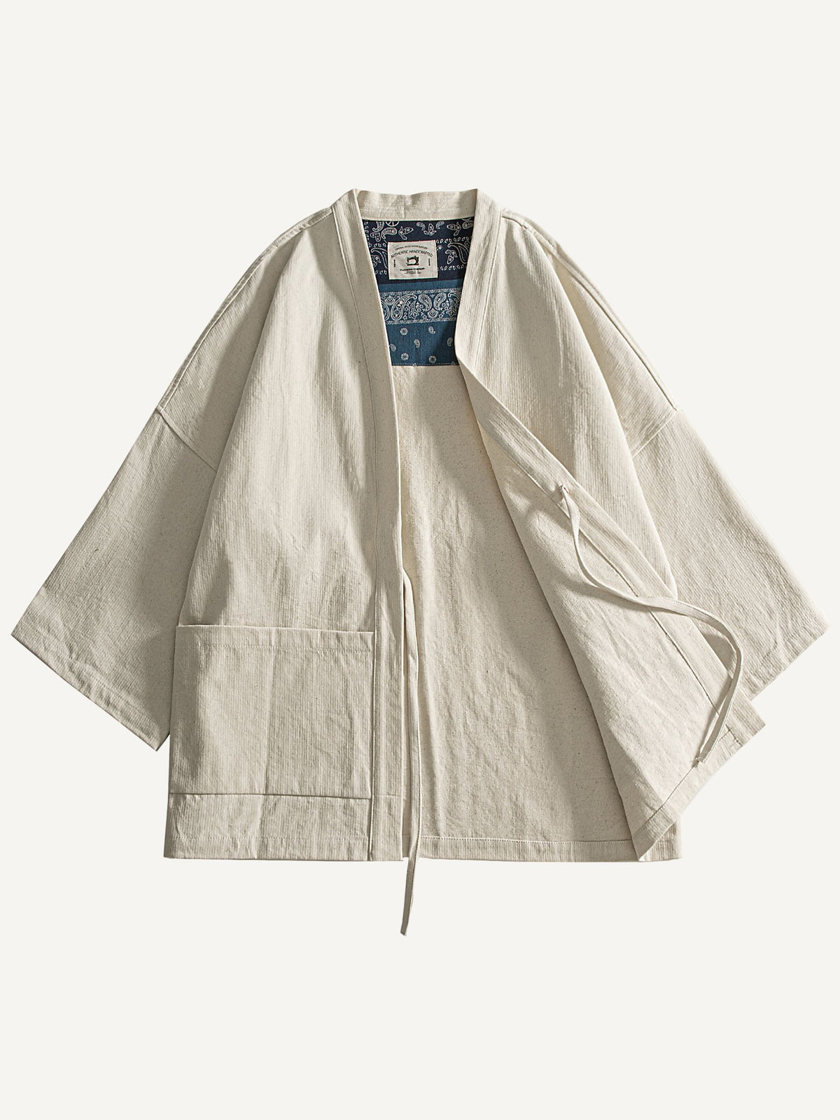 Front flat lay view of beige kimono cardigan jacket with one side draped open