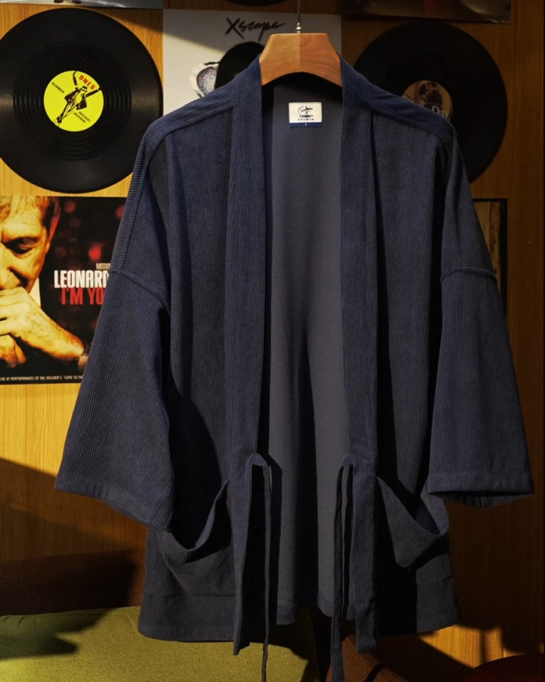 Front hanging view of OROMEN Mottainai corduroy haori kimono jacket in navy
